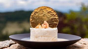A dessert on a plate with a scenic background.