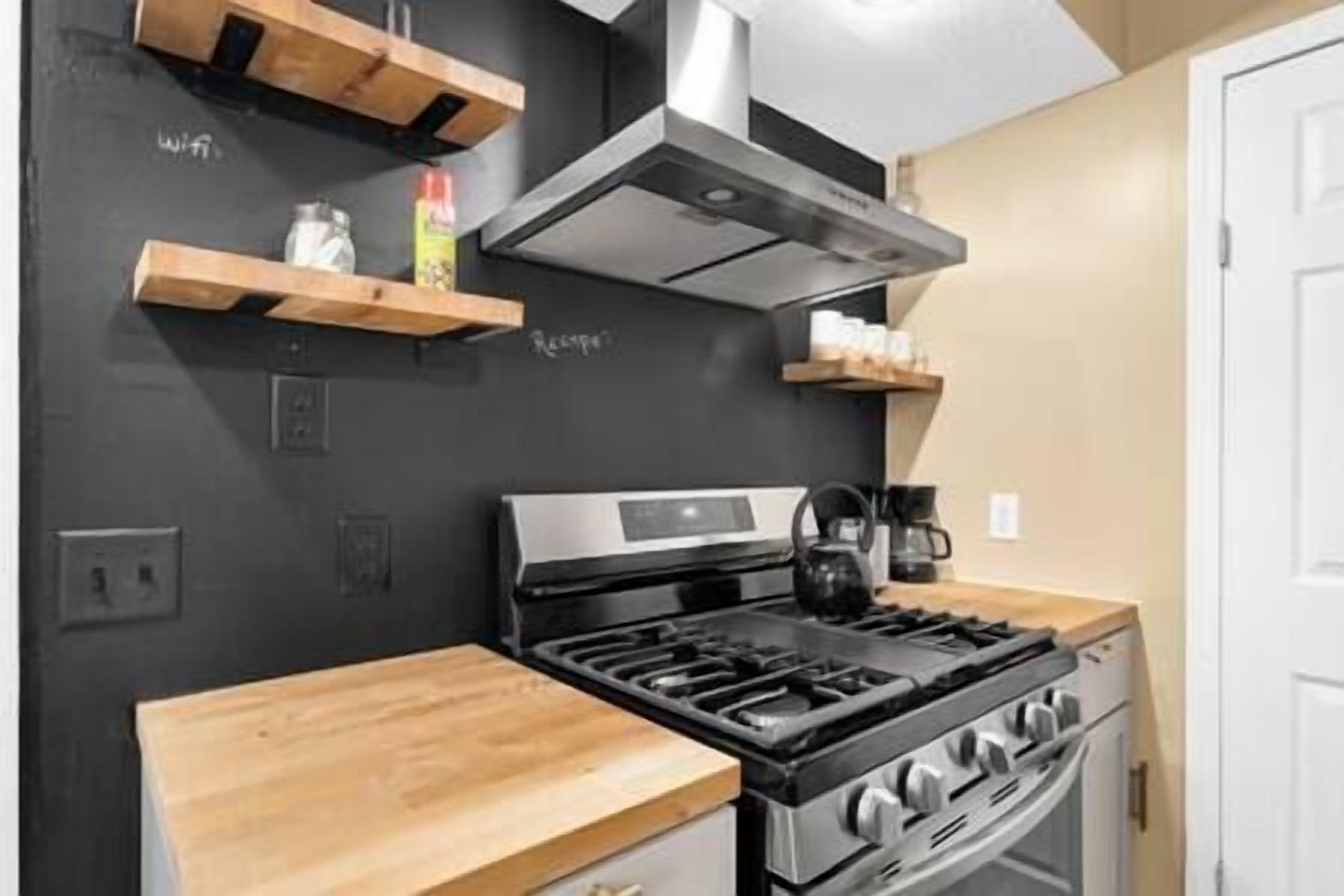 Fridge, coffee/tea maker, highchair, cookware/dishes/utensils