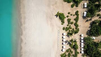 On the beach, sun loungers, beach umbrellas, beach towels