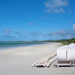 On the beach, sun-loungers, beach umbrellas, beach towels