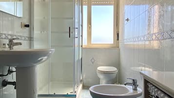 Standard Apartment | Bathroom | Shower, hair dryer, bidet, toilet paper