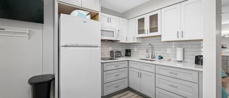 Fridge, microwave, stovetop, coffee/tea maker