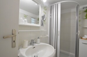 Shower, free toiletries, hair dryer, slippers
