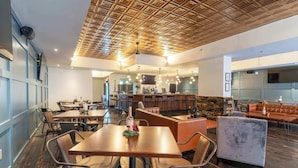 A restaurant with wooden ceiling, multiple tables, and chairs. - 2 Bedroom Suite (Frankfort)