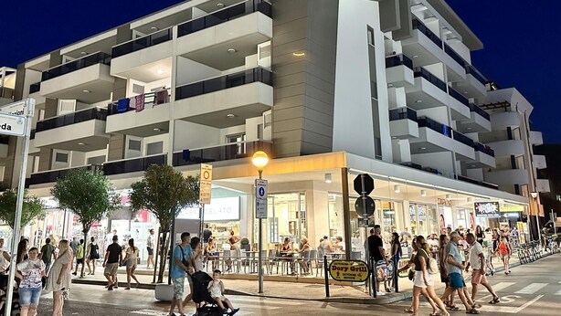 A multi-story building with balconies and a ground-level restaurant. - Quasar C in Bibione With 2 Bedrooms and 1 Bathrooms (San Michele al Tagliamento)