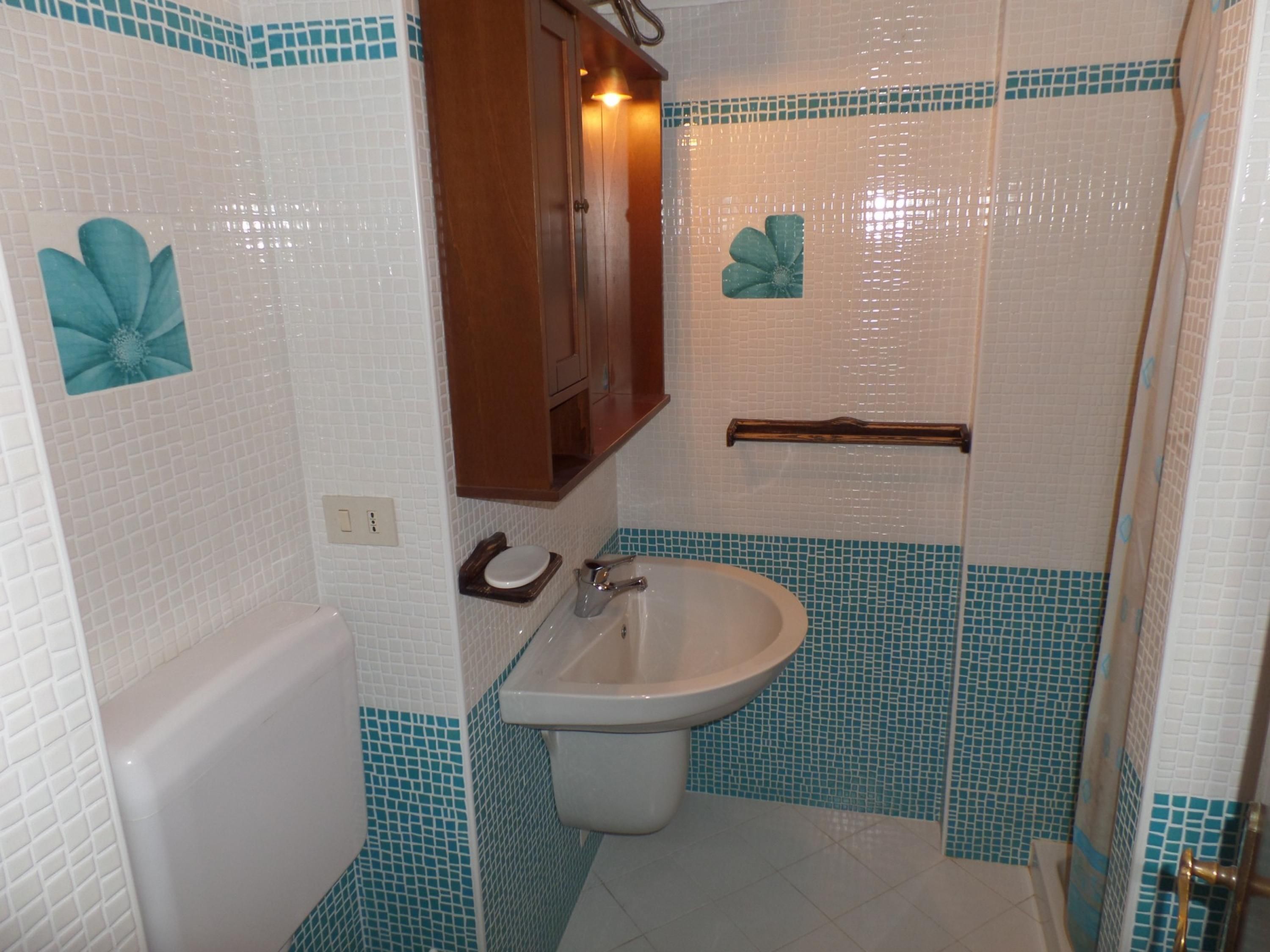 A bathroom with a bathtub, a sink, and a toilet.