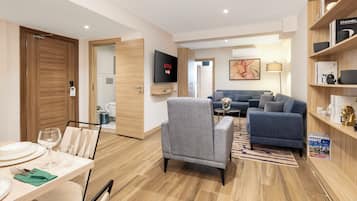 Senior Suite | Living room | 50-inch Smart TV with satellite channels