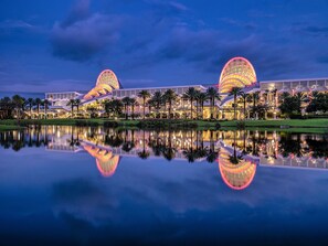 Two dome-shaped structures reflect off the calm water, creating a serene atmosphere.