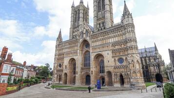 A historic cathedral with Gothic architecture, featuring tall spires and large arched windows.