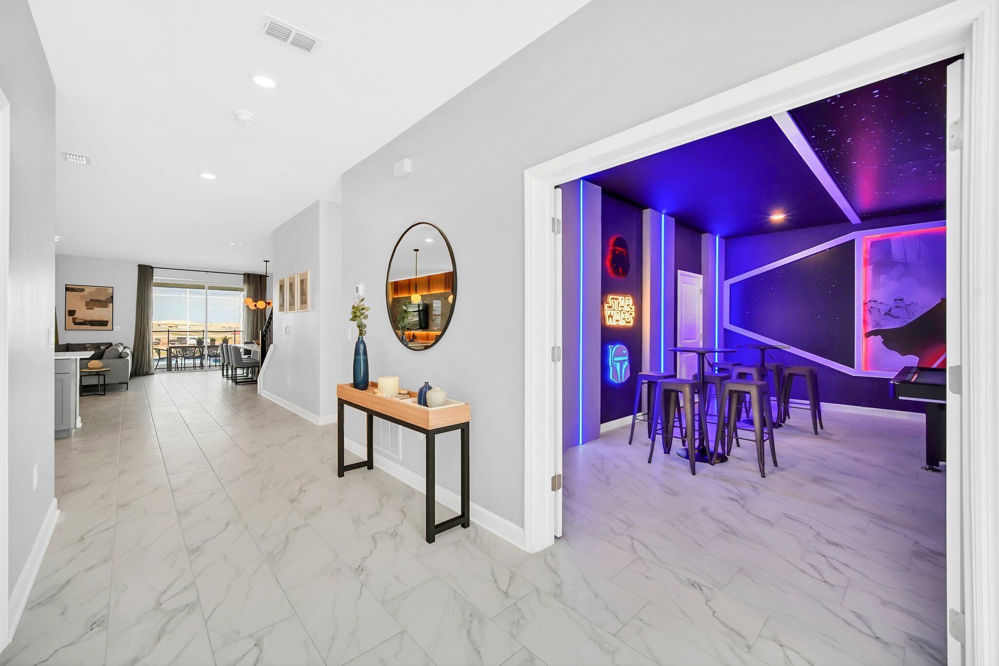 A modern interior with a dining area, a kitchen, and a living space.