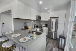 Fridge, coffee/tea maker, cookware/dishes/utensils - Bayfront Condo in Mission Beach (San Diego)