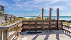 A wooden deck with a view of the beach and ocean. - Grand Sandestin by Southern Vacation Rentals (Miramar Beach)