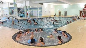 A large indoor swimming pool with multiple lanes and a central hot tub area. - Beautiful 2 Bed Caravan Southview Park Skegness (Skegness)