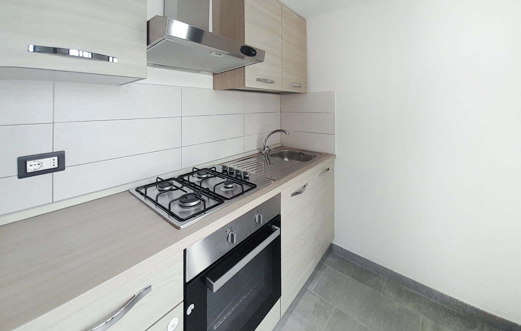 Fridge, stovetop, dishwasher, coffee/tea maker