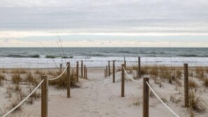 A sandy beach with wooden posts and ropes, leading to the ocean. - Newly Renovated, 1 min walk to beach, 3rd Row Emerald Isle Beach House (Emerald Isle)