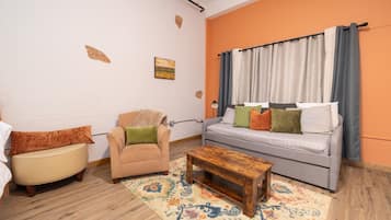 Hartwell Suites - Suite 1 | Living area | 55-inch Smart TV with digital channels
