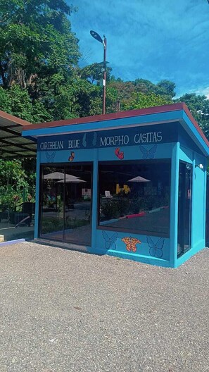 A blue building with the sign 'CARIBBEAN BLUE MORPHO CASTAS'. - Caribbean Blue Morpho (Puerto Viejo de Talamanca)