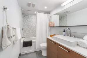 Shower, hair dryer, towels, soap