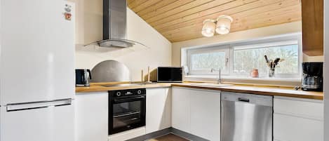 Fridge, stovetop, dishwasher, coffee/tea maker