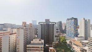 A high-rise building with a modern design, surrounded by other residential and commercial buildings. - Vn Oscar Freire (São Paulo)
