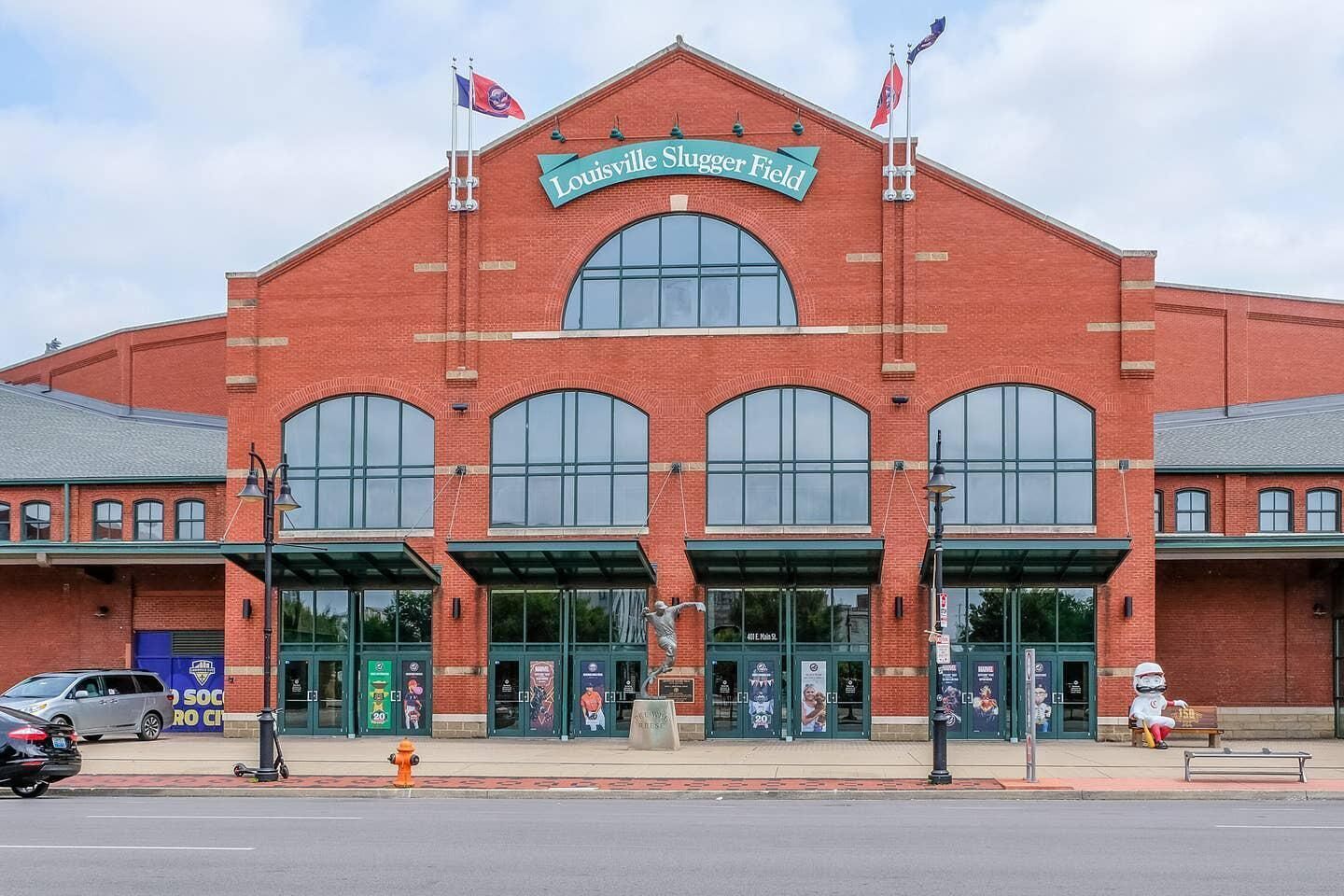 A red brick building with the sign "Louisville Slugger Field".