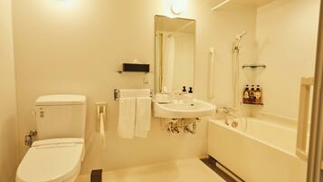 A bathroom with a toilet, sink, and bathtub.