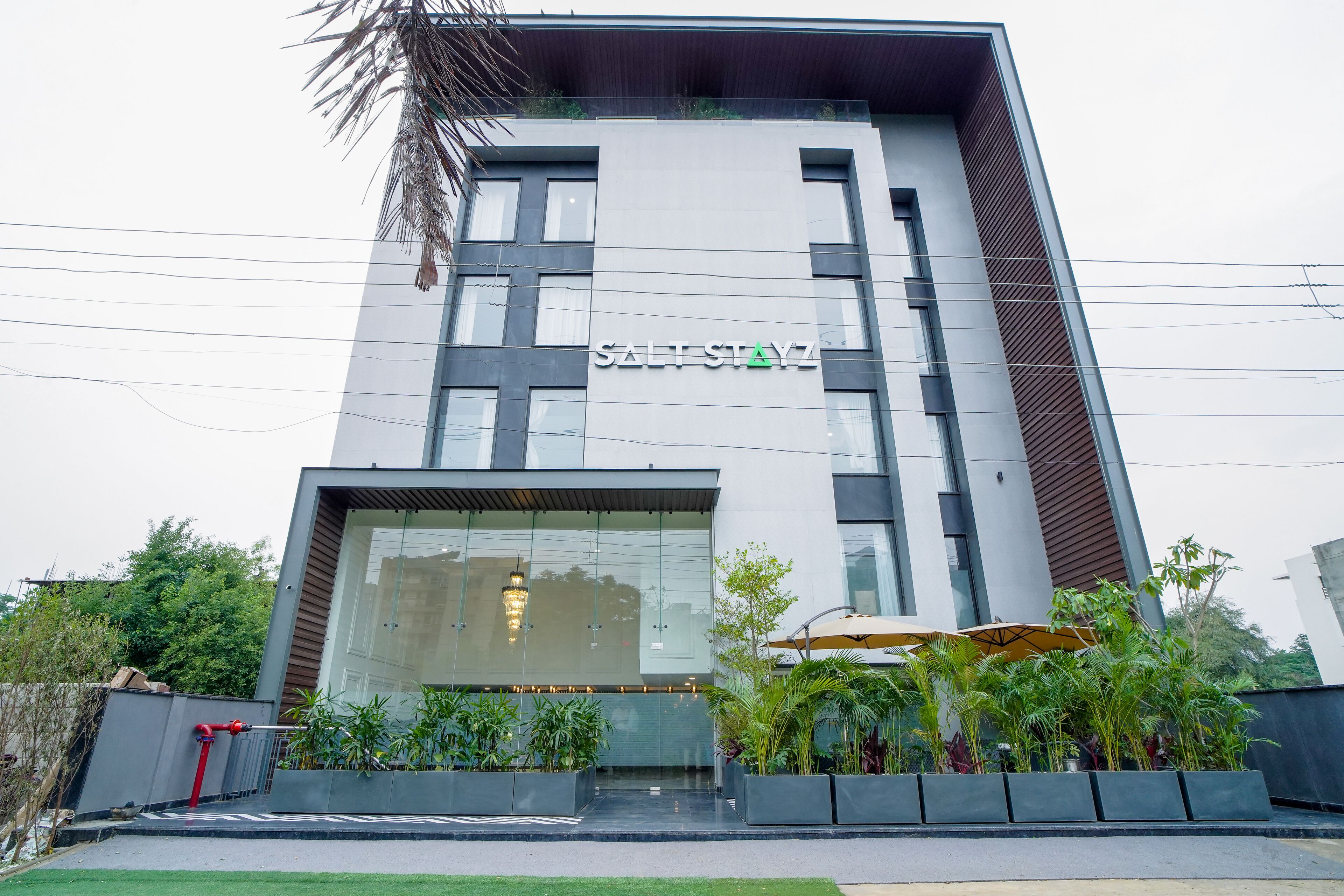 A modern building with the sign "SALT STAYZ" on the facade.