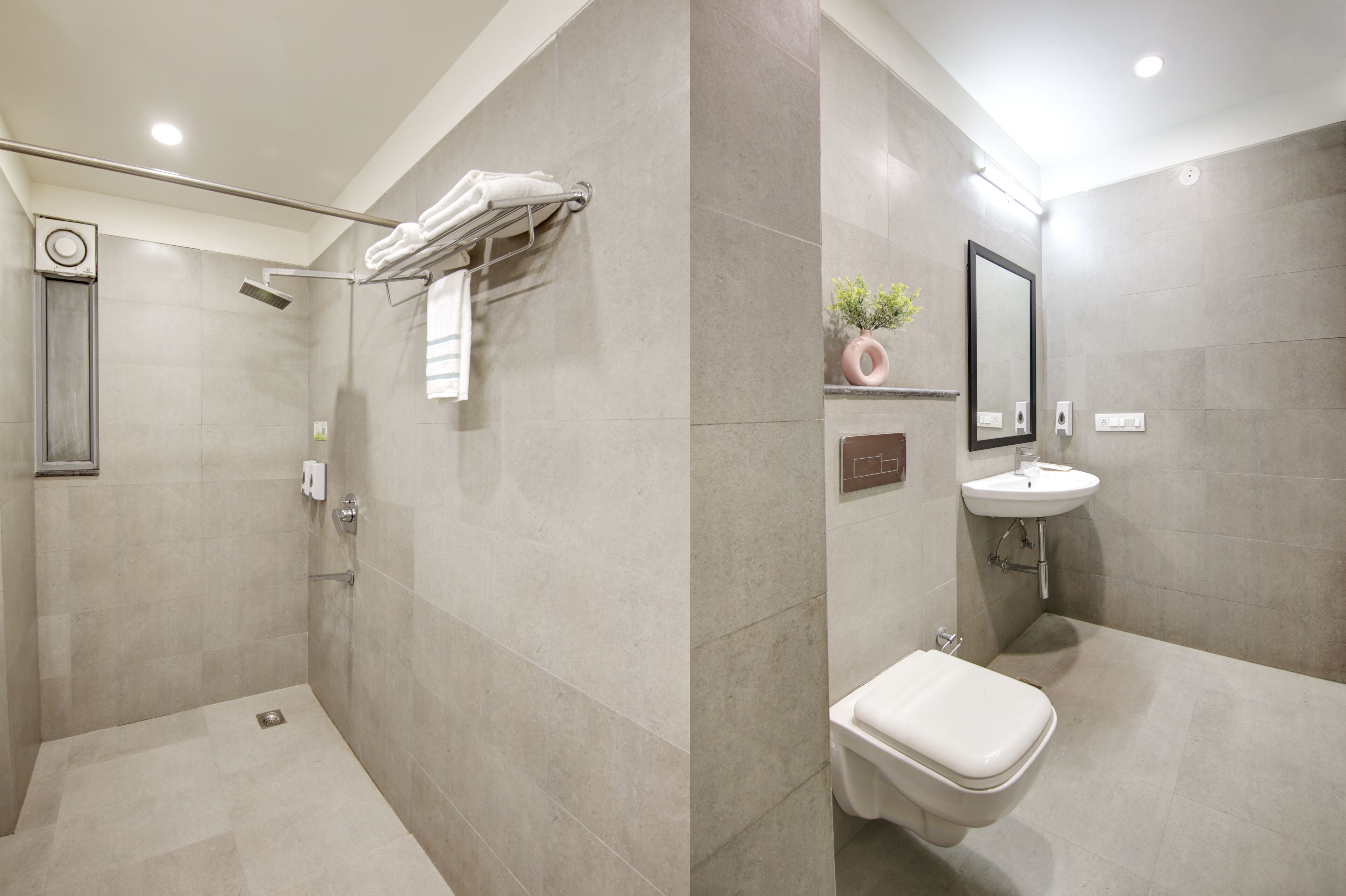 A modern bathroom with a shower, toilet, and sink.