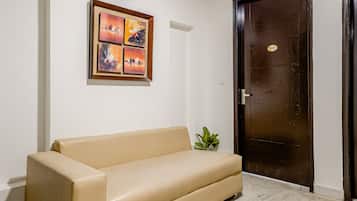 Premium Studio Suite | Living area | 42-inch flat-screen TV with satellite channels