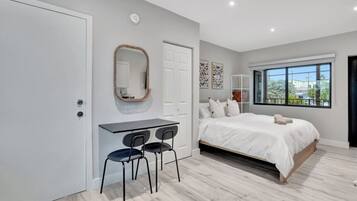 1 bedroom, desk, iron/ironing board, travel crib