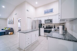 Fridge, microwave, oven, stovetop - Stylish Urban Haven • Cozy, Clean, Central (Tampa)