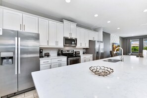 Fridge, microwave, oven, stovetop - Lavish Home near Disney with Media, Game & Theme Rooms with Waterpark & Resort Access at Encore. (Kissimmee)