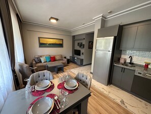 Classic Apartment, 1 Bedroom | Living area | 1-inch LCD TV with satellite channels - THE U HOMES (Antalya)