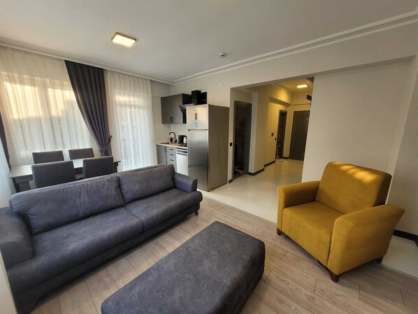 Basic Apartment | Living area | 1-inch LCD TV with satellite channels - THE U HOMES (Antalya)