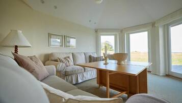 Deluxe Suite, Ocean View | Desk, laptop workspace, iron/ironing board, free WiFi