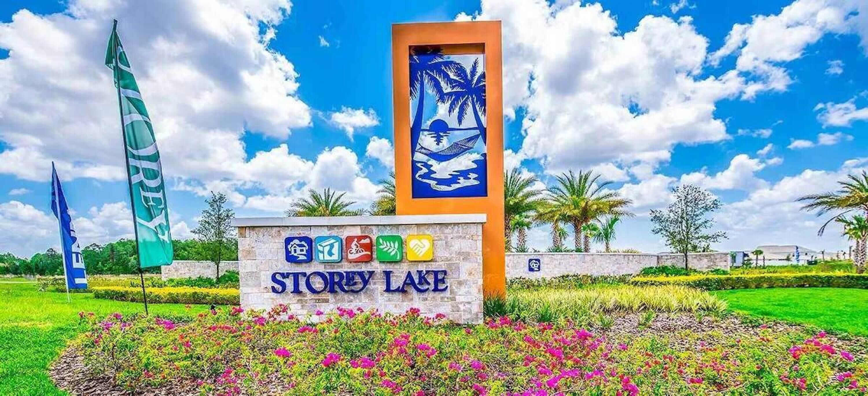A sign with the name 'STOREY LAKE' and symbols indicating amenities like a pool, gym, and restaurant.
