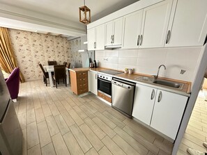 Standard Apartment | Private kitchen | Full-sized fridge, stovetop, dishwasher, electric kettle - The U Homes Turkuaz (Antalya)