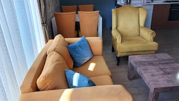 Family Apartment | Living area | 32-inch flat-screen TV with satellite channels