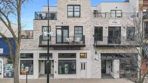 A multi-story building with a storefront named "LAUREL & JACK" on the ground floor.