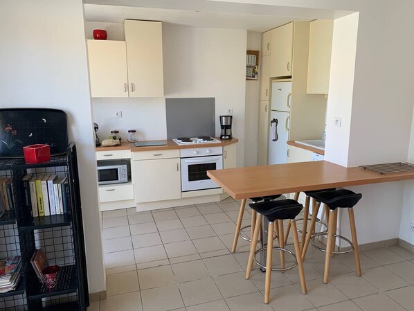 Fridge, microwave, cookware/dishes/utensils