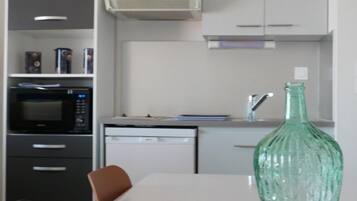 Fridge, toaster, cookware/dishes/utensils