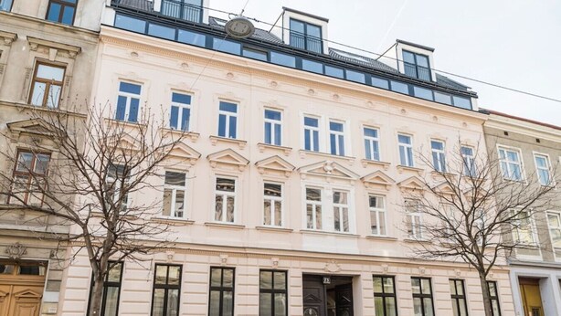 A multi-story building with a classical architectural style, featuring symmetrical windows and a central entrance. - Heart of Ottakring in Vienna (Vienna)