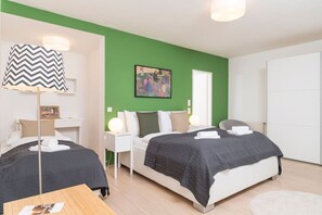 1 bedroom, desk, iron/ironing board, travel crib
