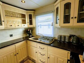 Cabin | Private kitchen | Fridge, microwave, oven, stovetop