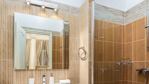A modern bathroom with a vanity, mirror, and shower. - Venus Apartments - Oktogon I (Budapest)