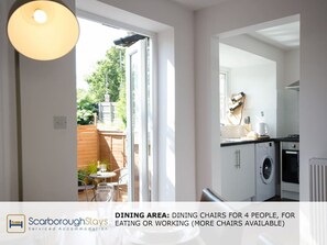 Enjoy meals and work sessions in this compact dining area with a sliding door leading to an outdoor space.