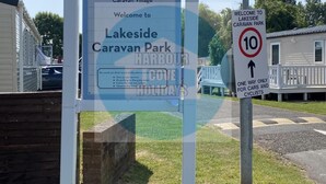 A sign for Lakeside Caravan Park with a speed limit sign indicating 10 mph. - Affordable Caravan Holidays, Butlins Minehead (Minehead)