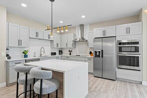 Fridge, microwave, oven, stovetop - Luxury Resort Home with pool heat as an extra cost (Kissimmee)