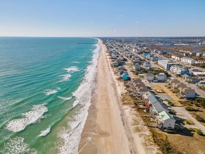 An aerial view of a coastal residential area with houses along the beach and a pier extending into the water. - Two Beaches - Amazing Sound Views Surf City (Surf City)