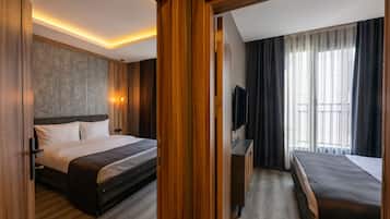 Family Room, 2 Double Beds, Kitchen, City View | Premium bedding, minibar, in-room safe, blackout drapes